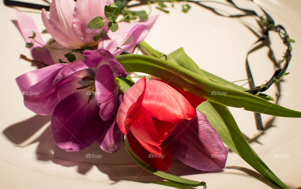 Flower crown with pastel multi colored tulips symbolic of love and happiness 