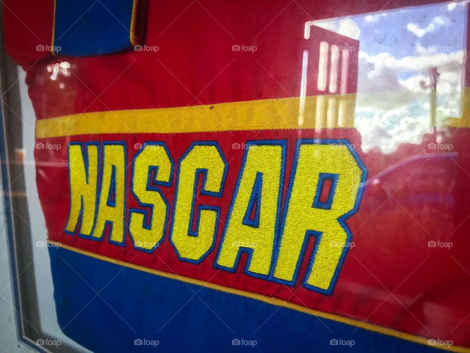 NASCAR memorabilia and the reflection of an open window.