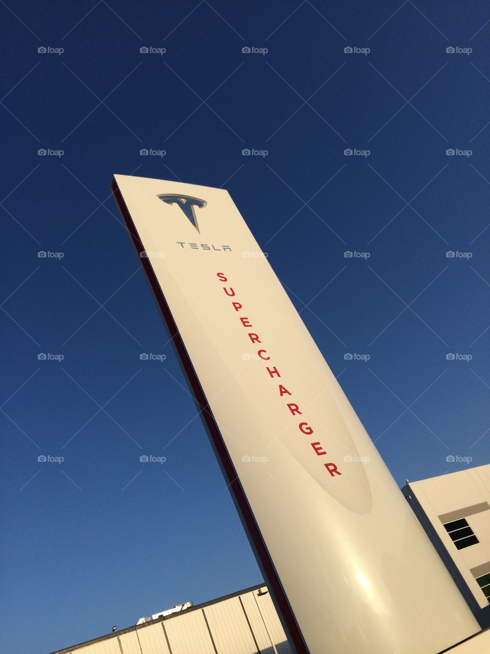 Tesla Supercharger Sign . Looking up at sign