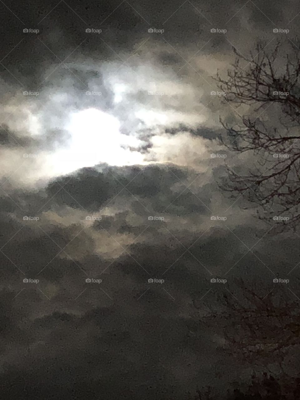 Moon lighting up clouds