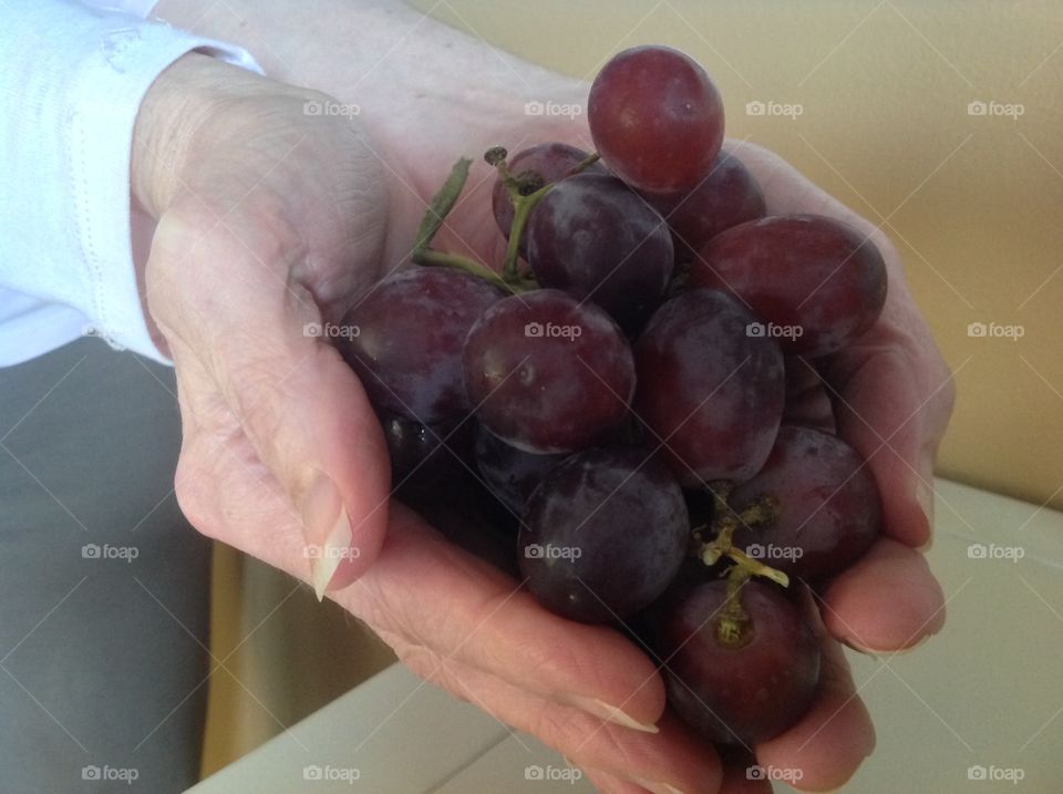 A handful of juicy red grapes.