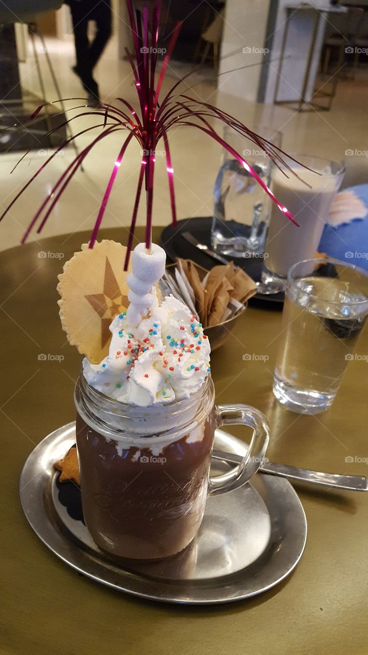 Sweet cold chocolate with cream and marshmallow
