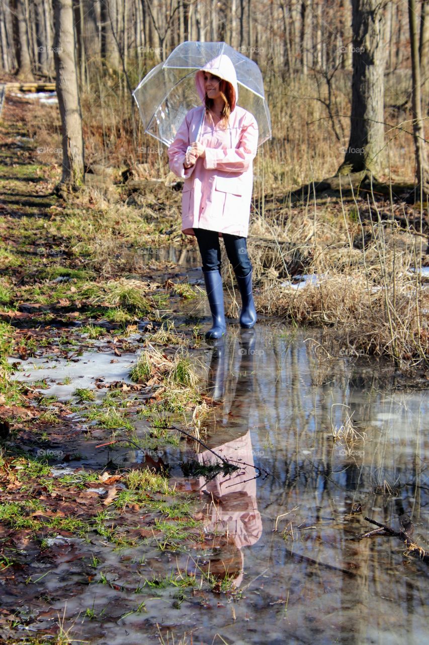 Woman wearing rain gear outdoors 