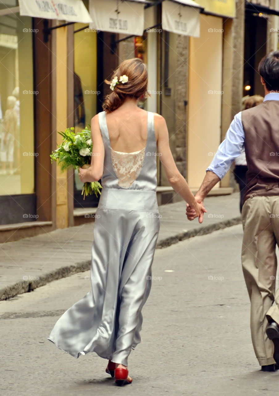 married couple walking in the street