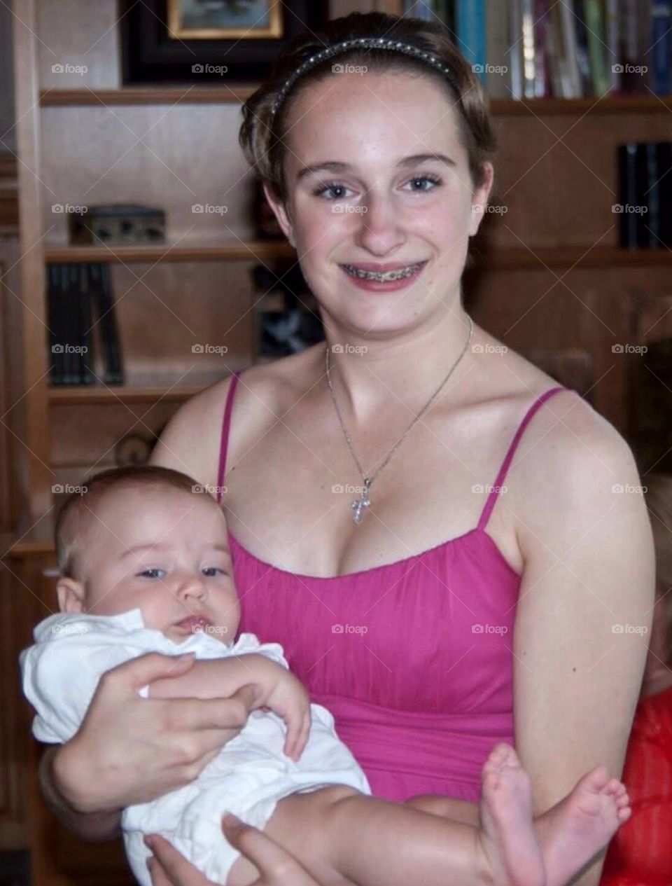 Teenager holding a baby. Young teen holding her Aunt's baby .