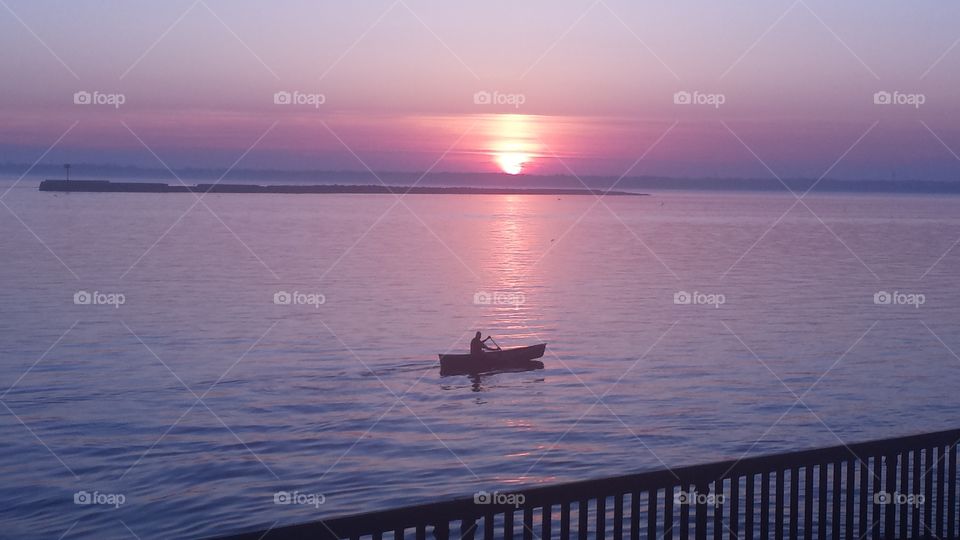 man in boat2. sunset on man in boat