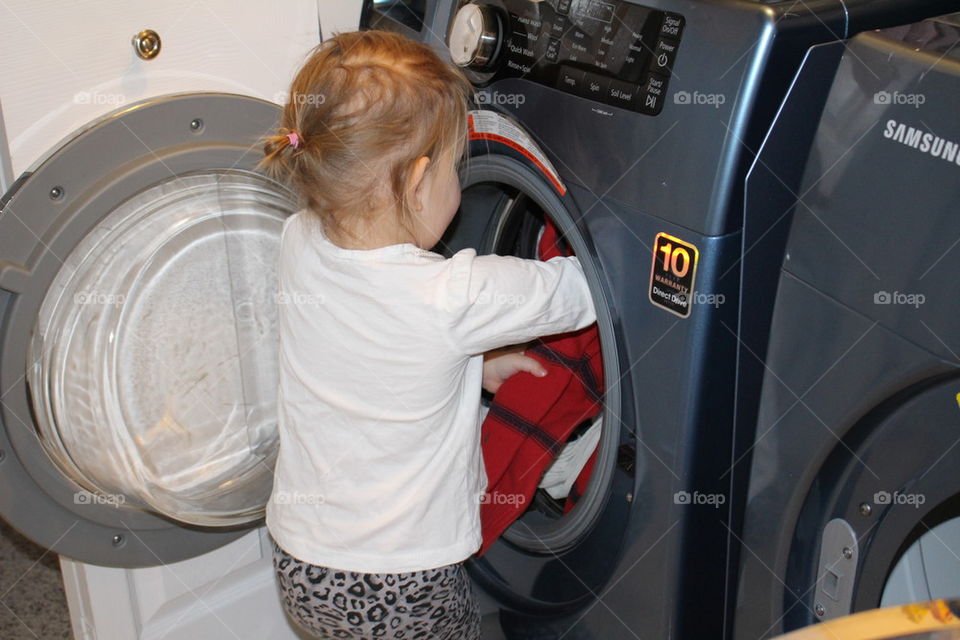 Young girl doing laundry