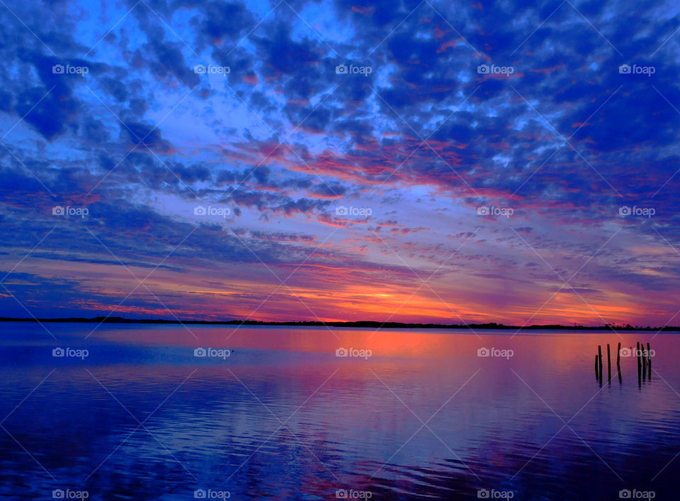 Blue Lagoon! Powder puff clouds blow across the bay and leave a mirror image! Sheet beauty!