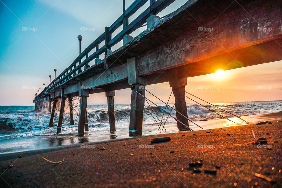 Sunset on a pier on the beaches of the Caribbean