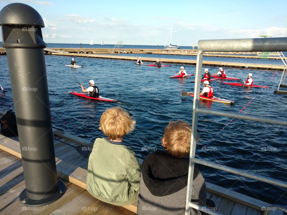 kids watching kayak