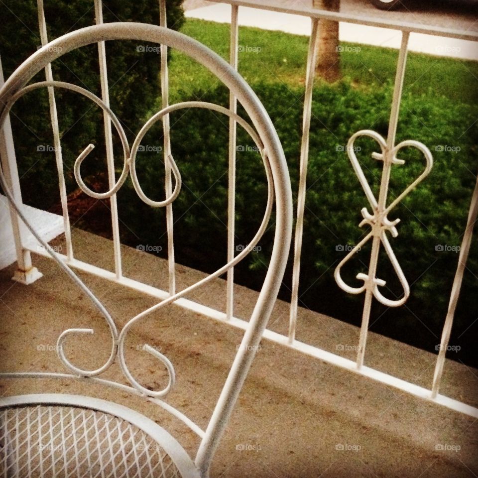 Hearts matching ❤️ wrought iron railing and repurposed bistro table. 