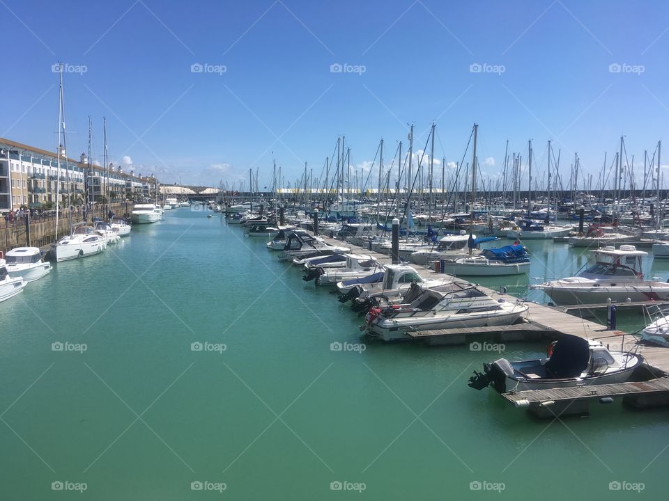 A view of the boats moored at Brighton Marina Village, East Sussex, England. Visited on a sunny Sunday in Summer.