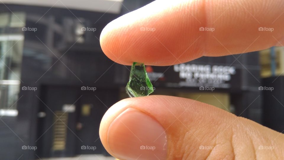 Holding a piece of glass I found.