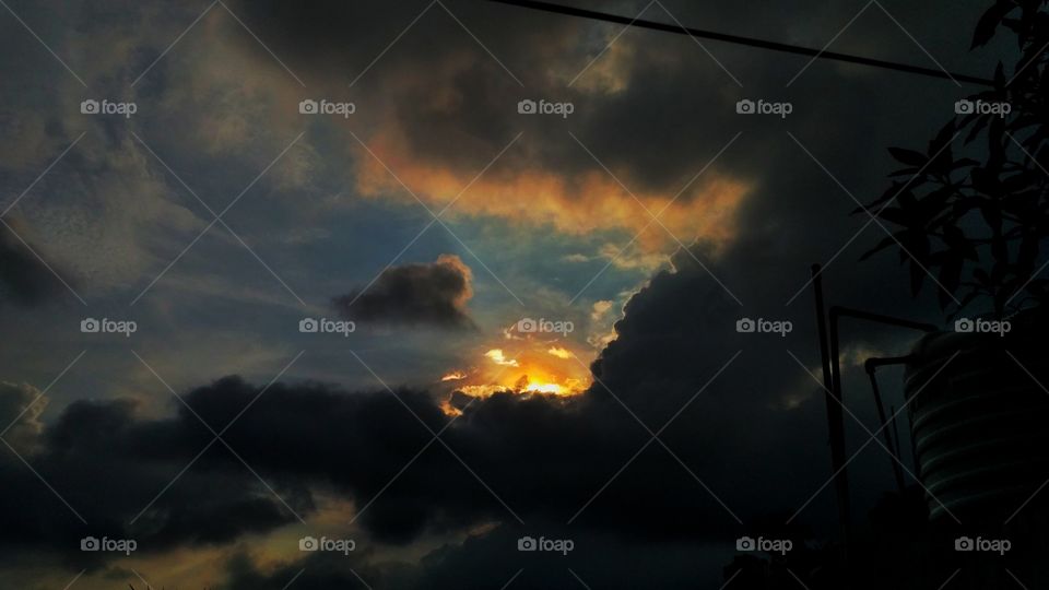sun set in cloud
