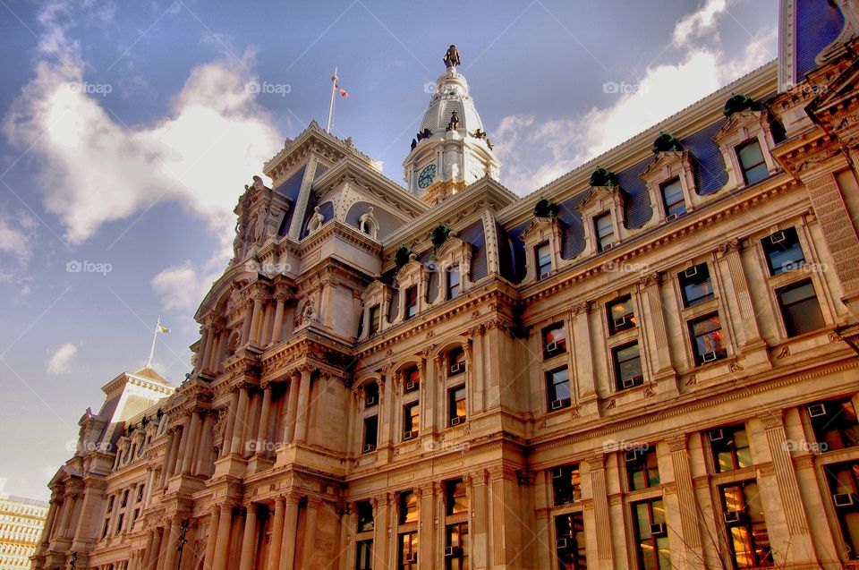 Gothic architecture of Philadelphia City Hall gate and clock tower with Quaker statue