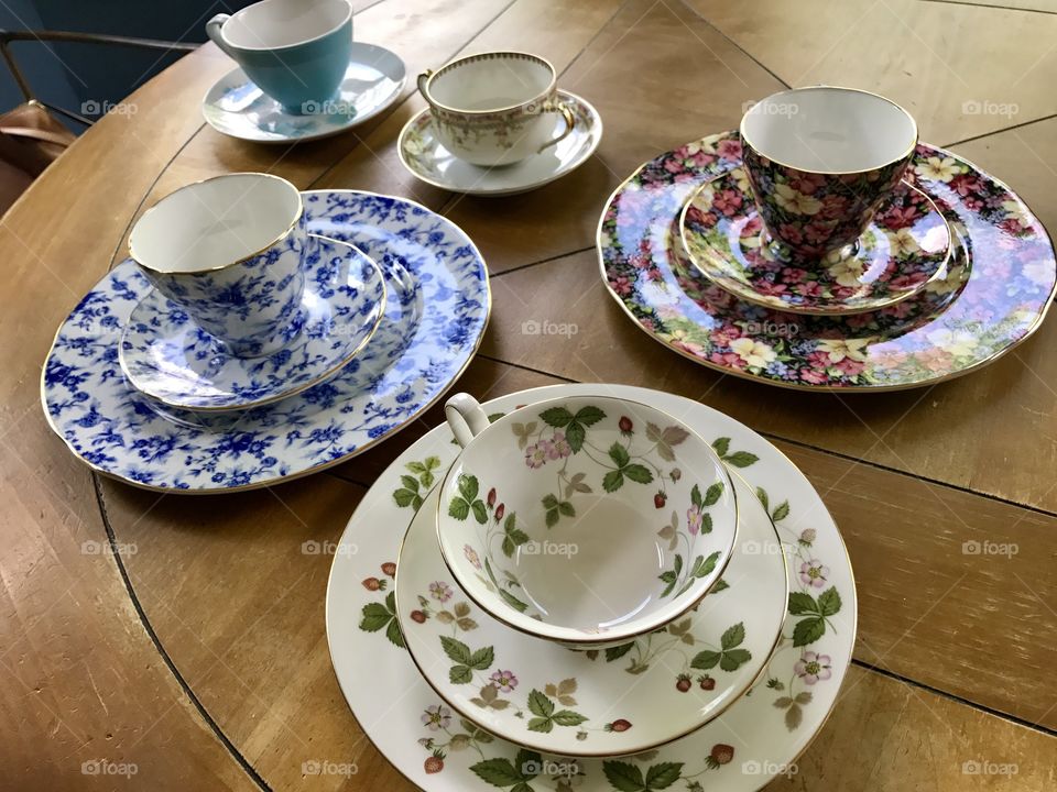 Elevated view of teacup and saucer on table