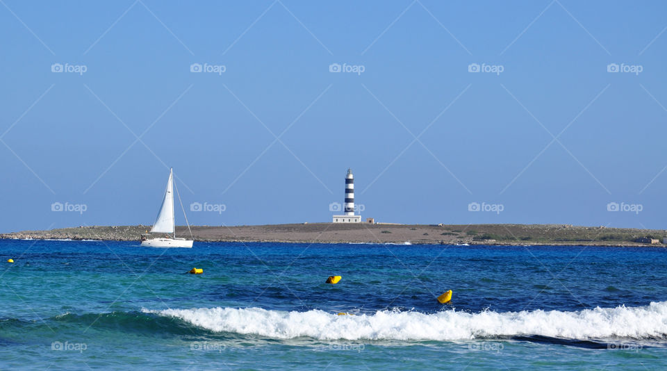 Yacht and lighthouse 