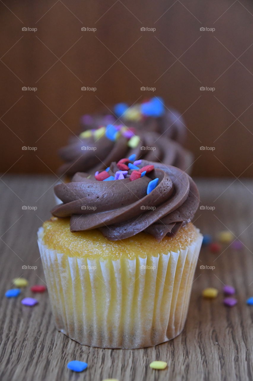 vanilla cupcakes with chocolate icing