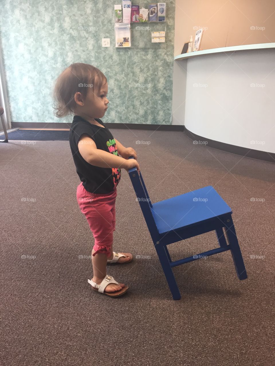 Child playing wity chair