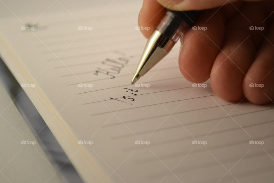 writing on a notebook