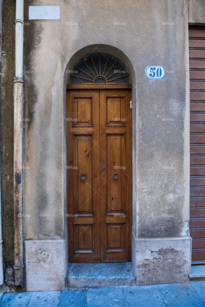 Old door in the city of Cefalu on Sicily.