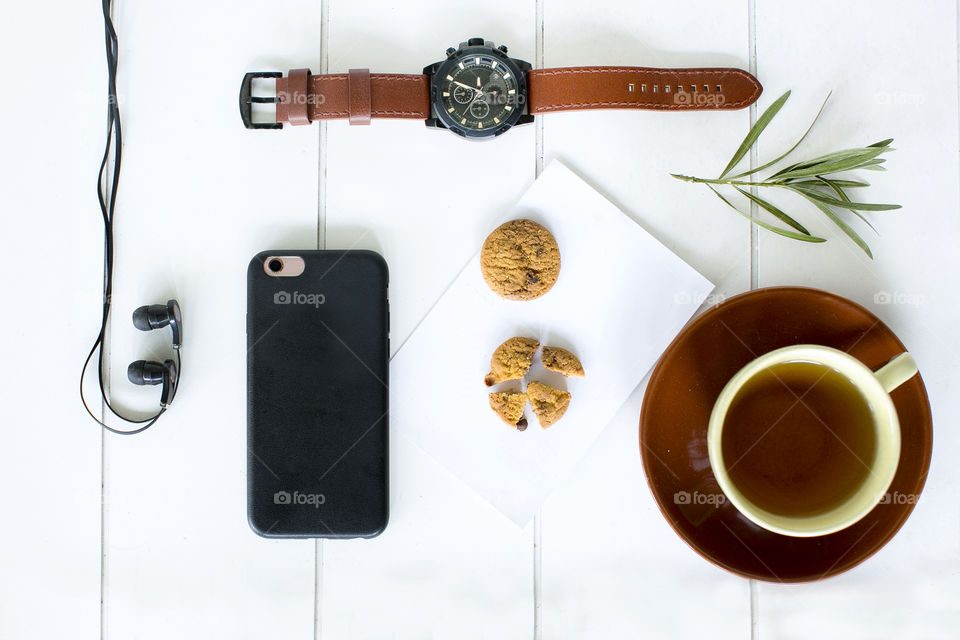 Tea break flatlay with white background 