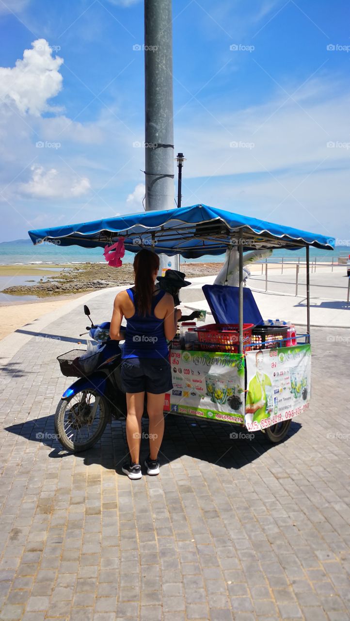Ice-Cream vender in Thailand on a beach in Pattaya.