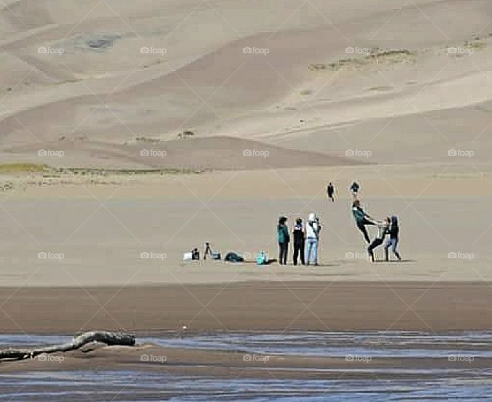 People playing in the sand at Great Sand National Park