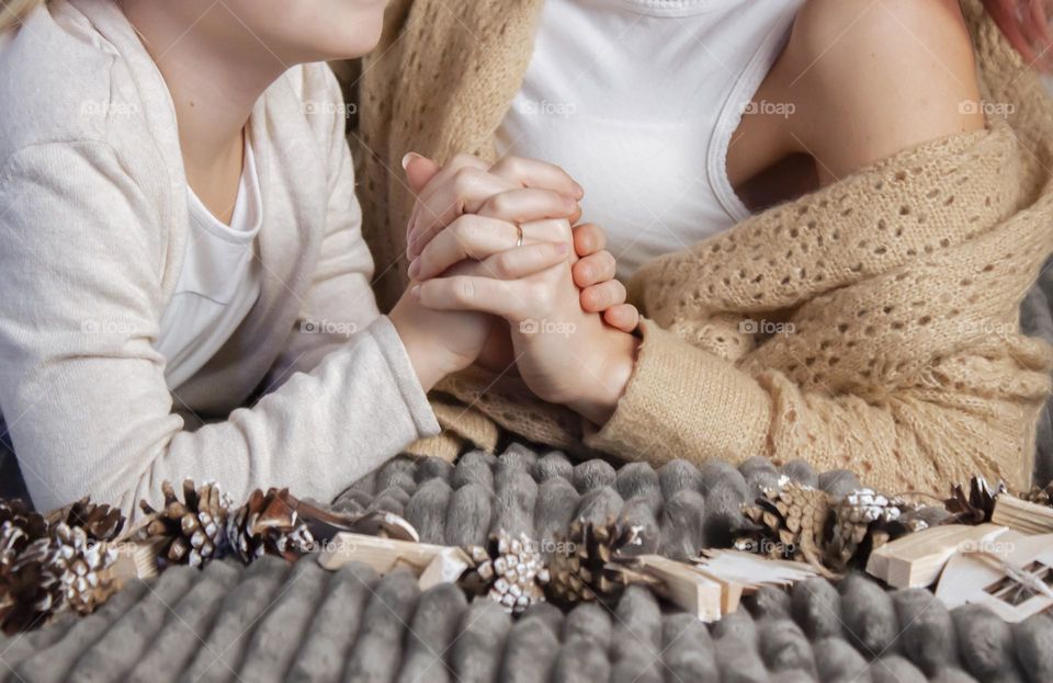 mother and daughter holding hands