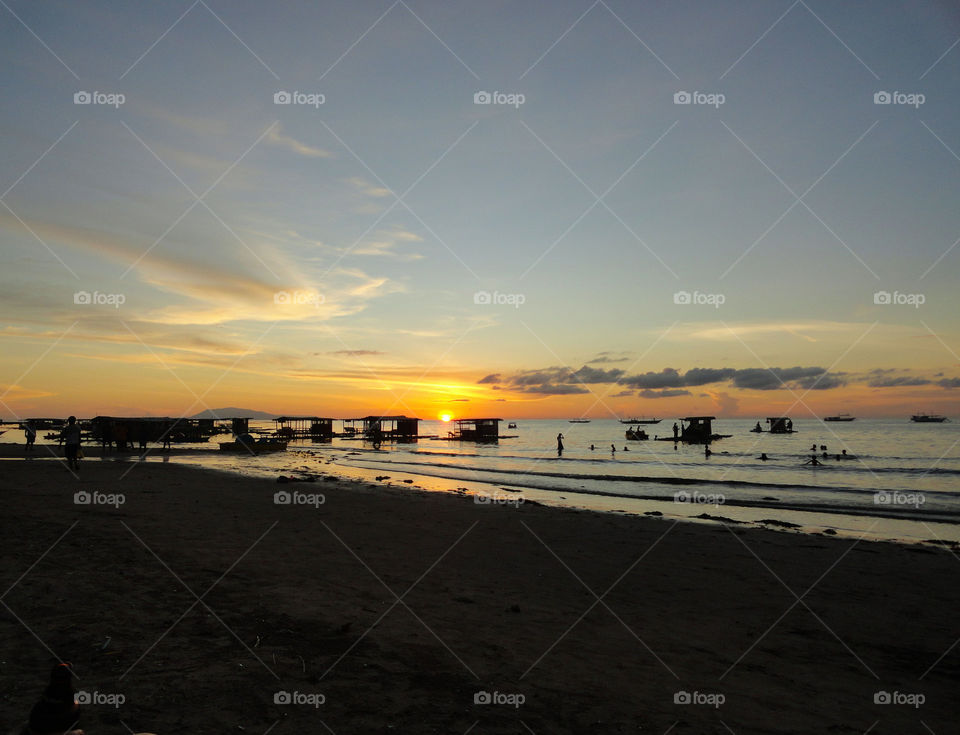 Scenic view of sea against orange sky