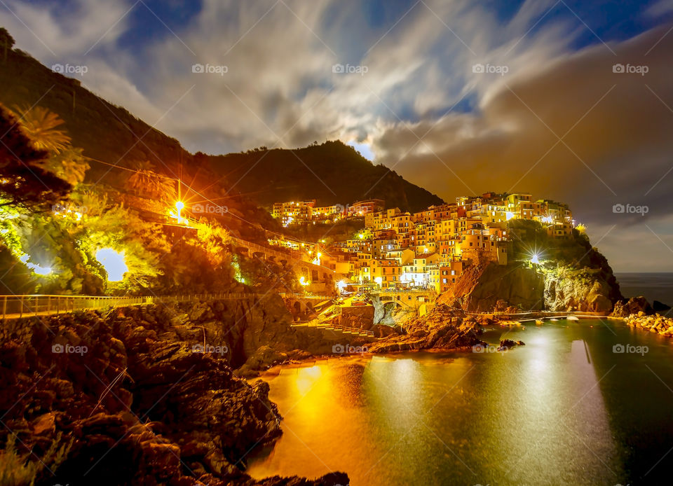 Illuminated view of Manorola city during sunset