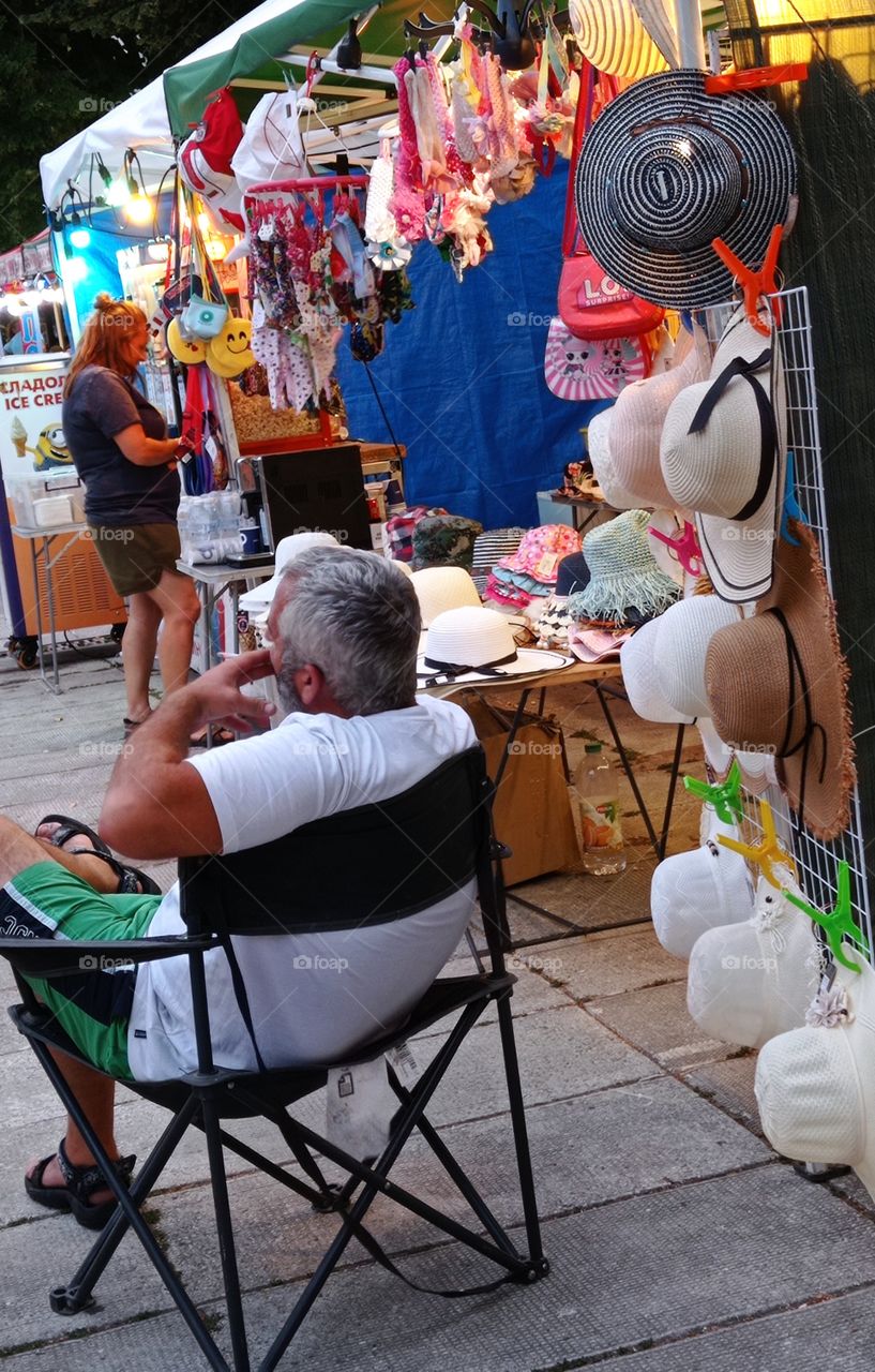 Summer street market. Hats