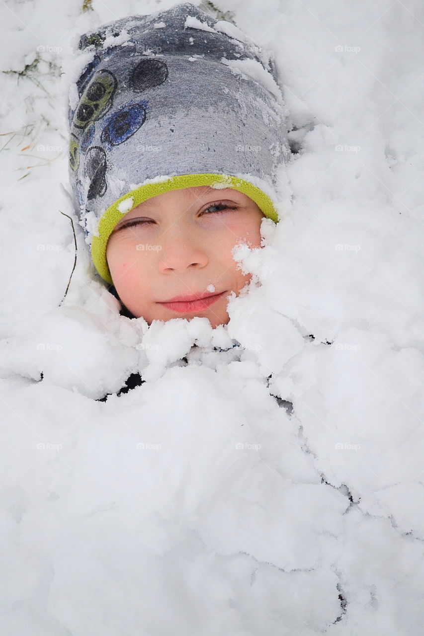 Portrait of a girl cover with snow