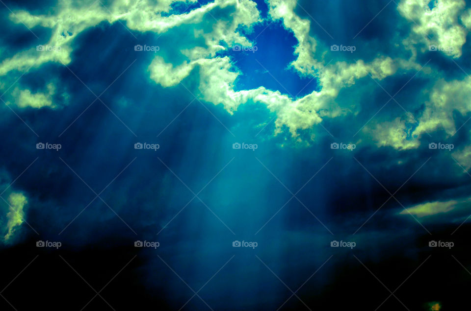 Sun shining through the clouds