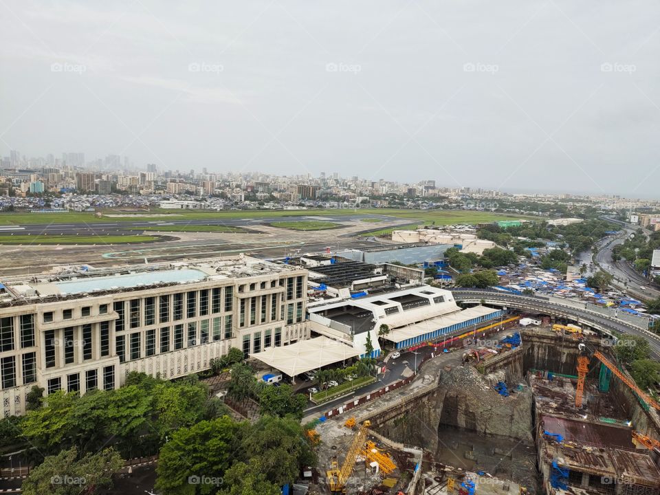 Hotel Taj Mumbai,India,
With Pleasent Green  Background and Front Construction Site, Arabian sea in far sight