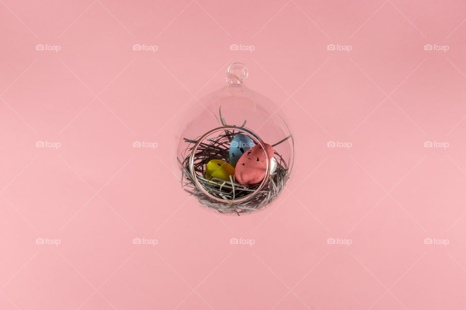 Easter eggs in floatin glass nest