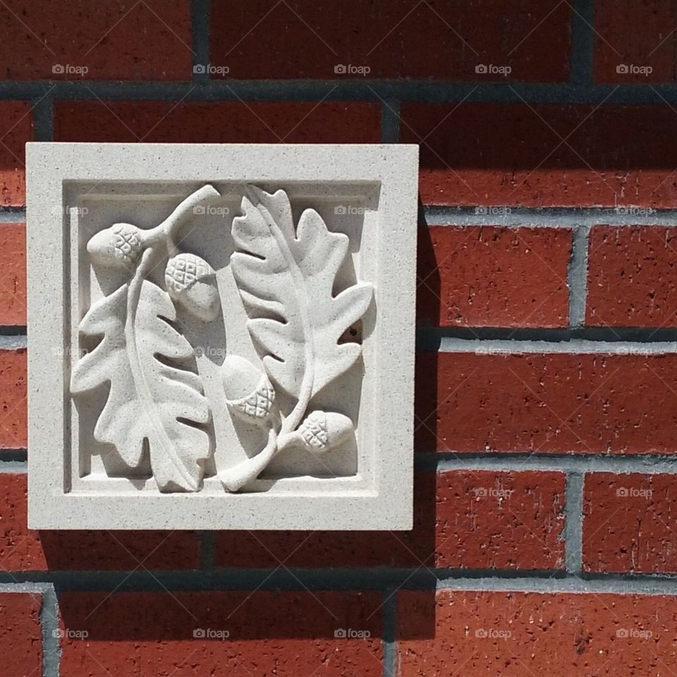 Decorative Marble Carving on Brick Wall