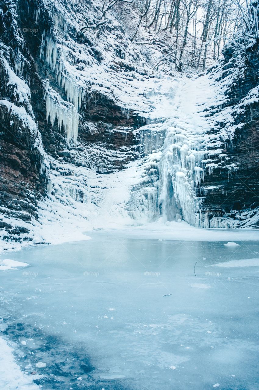 frozen waterfall in mountains