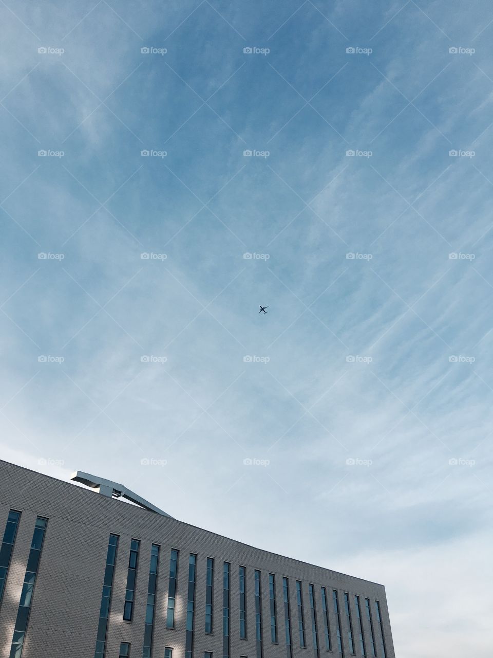 Plane over building