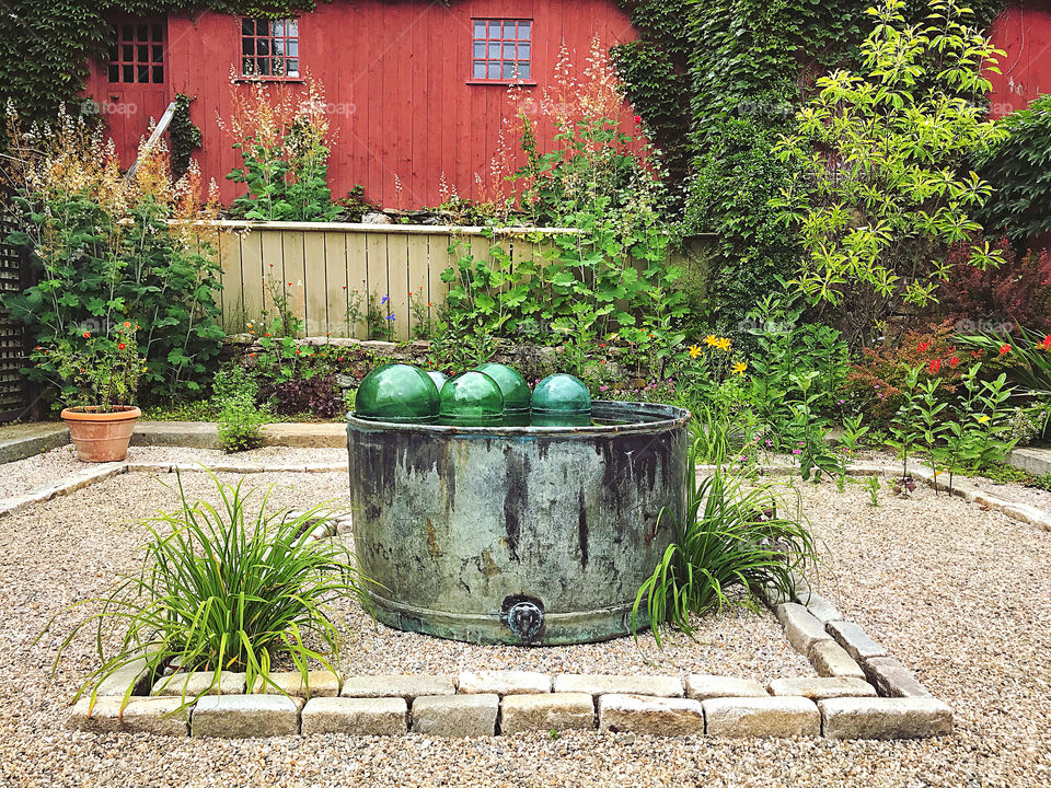 Glass spheres floating in a large container 