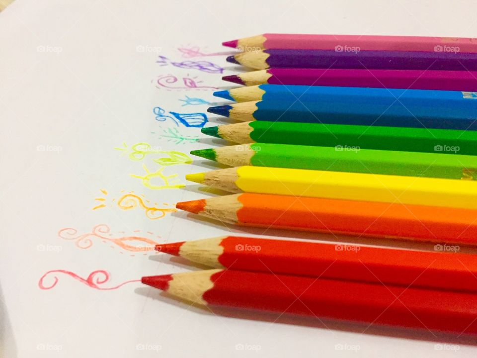 Colored pencils in a row