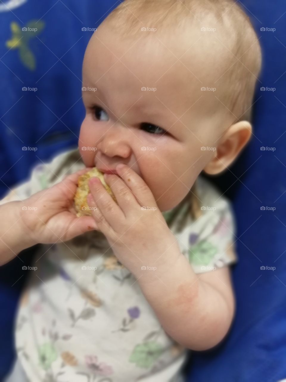 Baby eating the meat