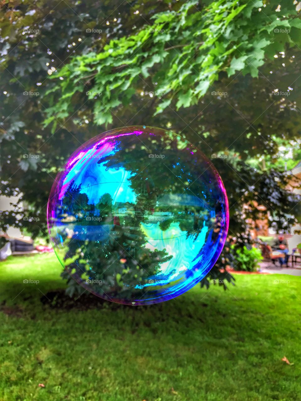 Blowing bubbles . So many colors 