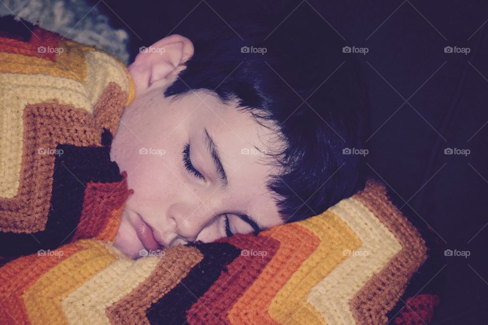 Boy sleeping with blanket