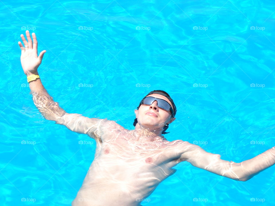 Man enjoying in swimming pool