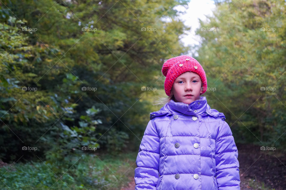 child in the autumn forest