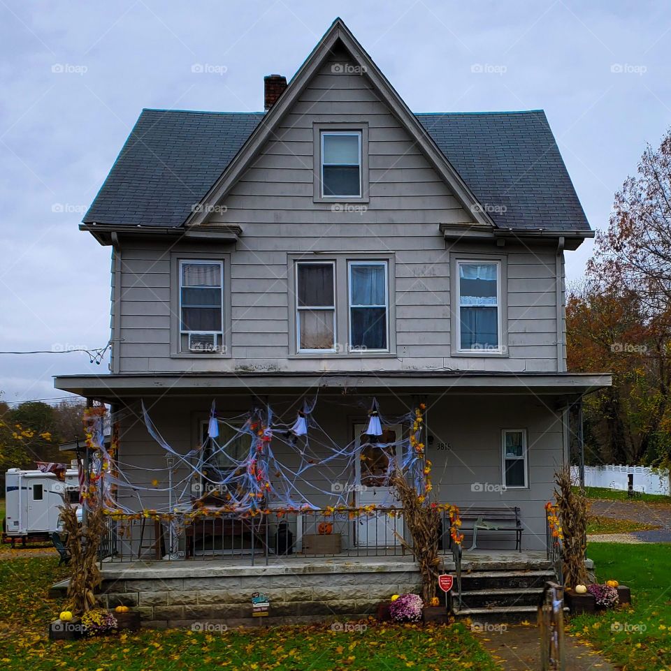 This rundown house with a crooked porch makes for a perfectly creepy Halloween destination