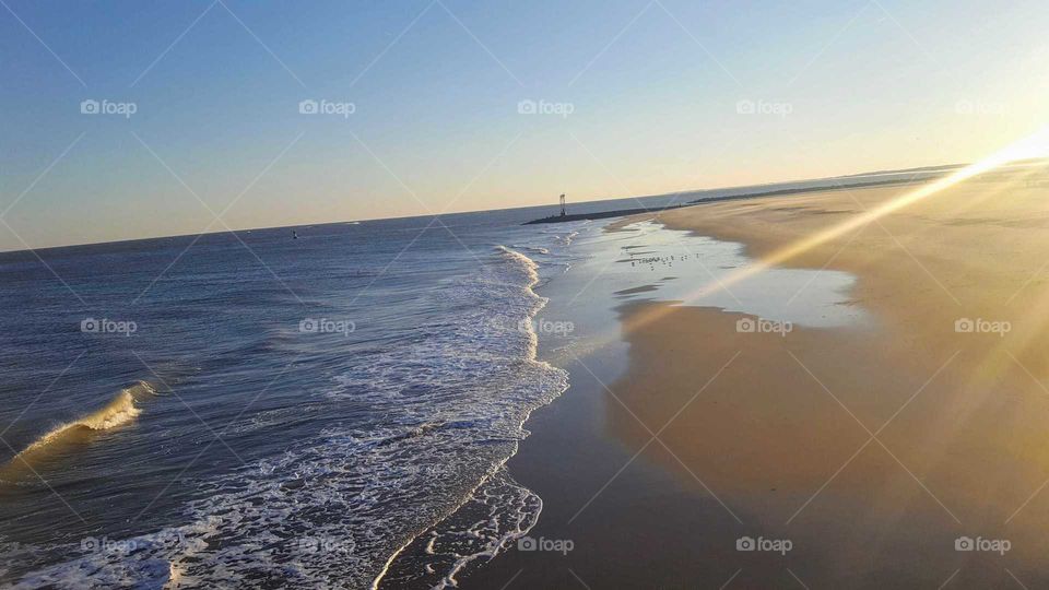 Sunset on the beach ocean sand waves