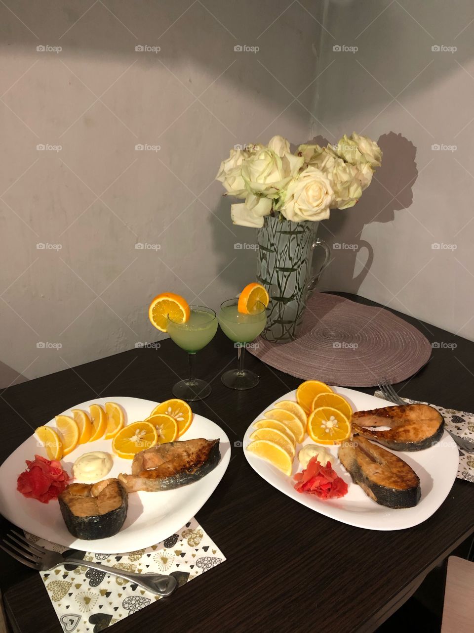fried salmon fish with orange and lemon slices