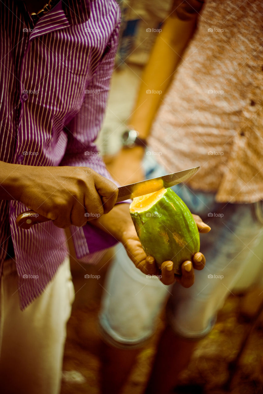 papaya in hands
